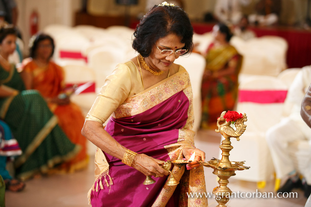 Sri Balathandayuthapani hindu temple wedding aunty lights candles